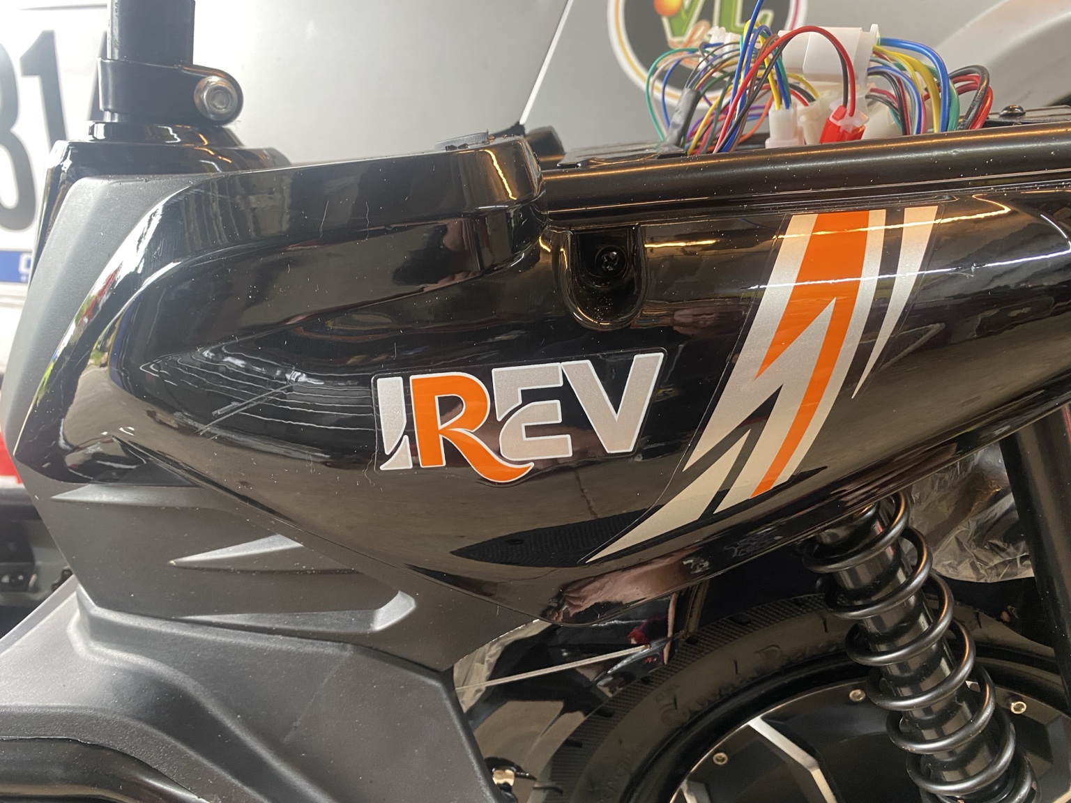 iREV branding and rear suspension · Actual item photo