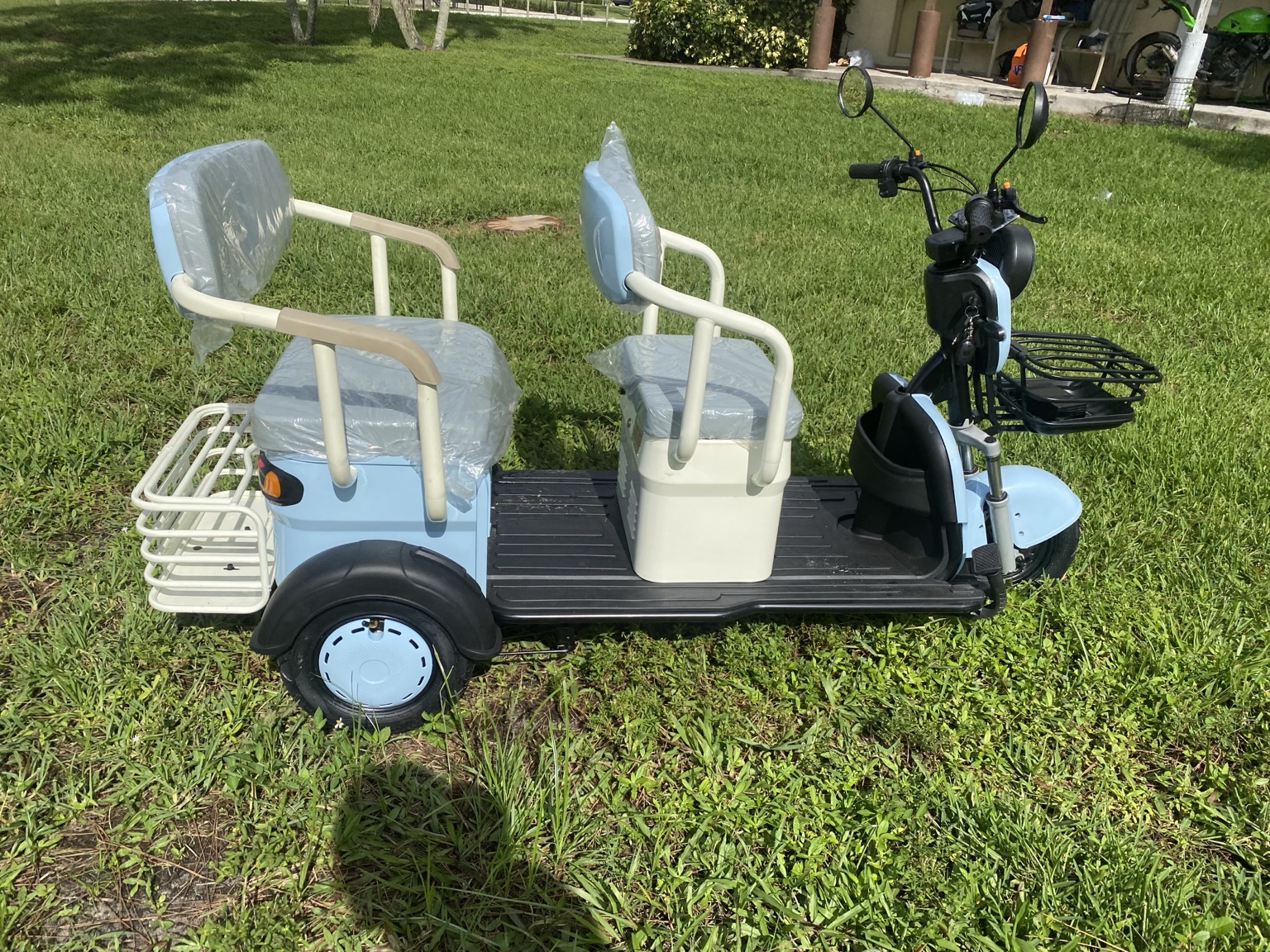 Light blue MGC40 two-seat electric trike — actual item photo